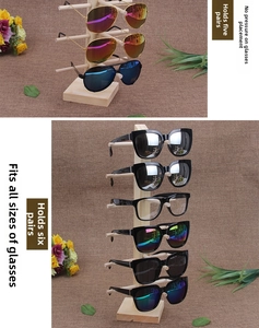 Detail of 5 and 6 tier single row wooden display stands for multiple glasses styles