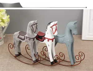 Three vintage wooden rocking horse figurines with metal rockers for home shelf decor