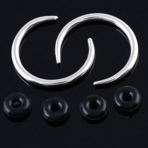 Polished stainless steel C-shape ear expanders with rubber O-rings on black background