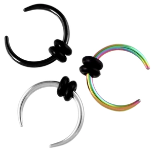 Detail view of C-shaped steel septum rings in black, silver, and rainbow colors