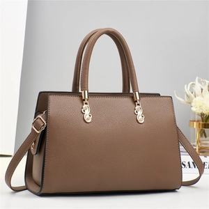 Coffee brown textured leather tote bag with gold S-shaped hardware and shoulder strap