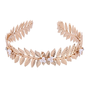 Golden leaf bridal tiara with white pearls and rhinestones on a white background
