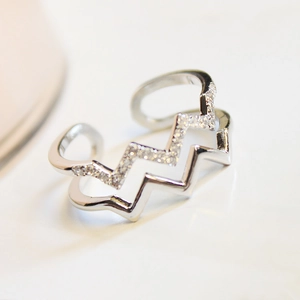 Detailed view of double-layer wave ring with micro-pave cubic zirconia and adjustable opening