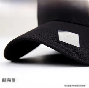 Detail of a durable black baseball cap brim showing twill texture and flexible resilience