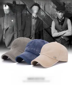 Detail view of washed cotton baseball caps with metal logos in brown, navy, and khaki