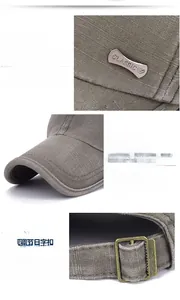 Detail of washed cotton baseball cap showing metallic classic badge and bronze buckle