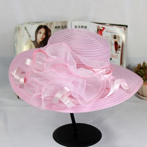 Detailed view of pink mesh sun hat with large organza floral trim and ribbon detail