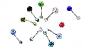 Macro detail of multi-color crystal belly button rings in assorted vibrant gemstone sets