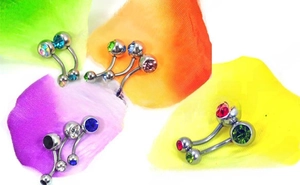 Detailed set of stainless steel navel rings with colorful crystals on vibrant petals