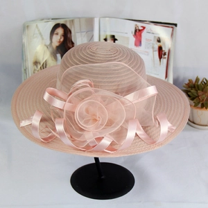 Elegant organza sun hat with large floral decoration in pale pink for wedding parties