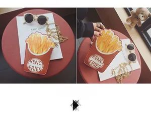 Macro detail of quirky French Fries shaped crossbody bag with gold chain strap