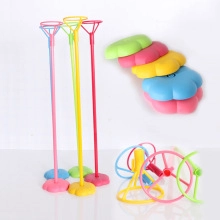 Close-up of colorful plastic balloon stand kits with bases and sticks for party decor