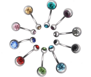 Close-up of ten colorful stainless steel belly rings with faceted crystals in a circular layout