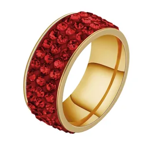 Luxurious gold stainless steel wide ring featuring four rows of pavé-set red crystals