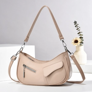 Chic beige hobo shoulder bag in faux leather featuring a trendy half-moon design and silver zip