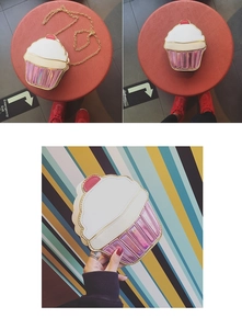 Detail of a cupcake shaped crossbody bag with laser pink base and gold chain strap