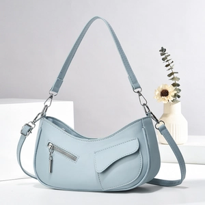 Elegant light blue crescent underarm bag with double straps and matte leather finish