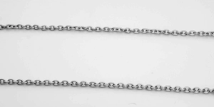 Macro view of stainless steel cable chain links with polished silver finish texture