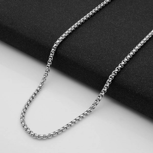 Polished silver stainless steel box chain necklace with a minimalist geometric design