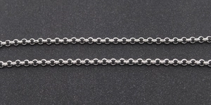 Detailed close-up of 3mm silver stainless steel round pearl chain links on dark background