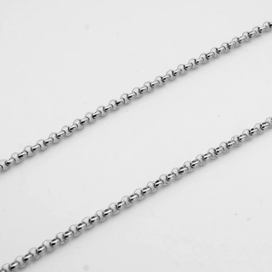 Macro shot of 3mm silver stainless steel round pearl chain links with polished finish