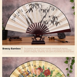 Detail of traditional Chinese folding fans featuring ink bamboo and peacock patterns
