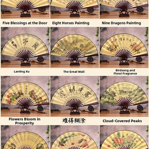 Detail view of various traditional Chinese folding fans with artistic landscape painting