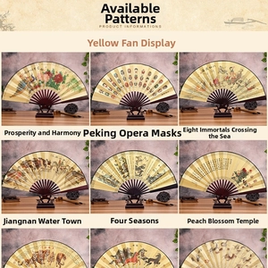 Close-up of nine traditional Chinese folding fans with yellow silk and vintage art motifs