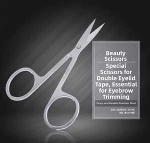 Close-up of sharp stainless steel beauty scissors for eyebrow shaping and eyelid tape