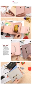 Detail showing short women wallet with cat ear metal clasp and long tassel charm in various colors