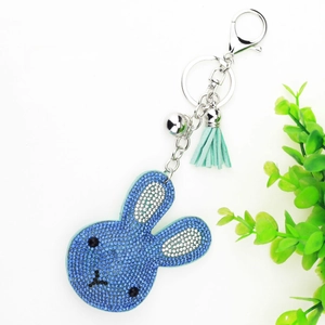 Detailed view of blue rhinestone bunny keychain with 185mm length and green tassel