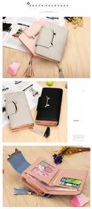 Detail view of cat ear wallet interior with card slots and cute tassel zipper charm