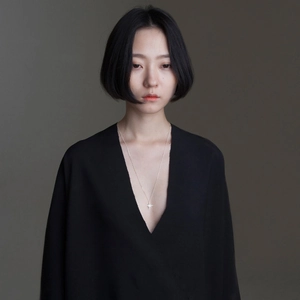Elegant 925 sterling silver star pendant necklace on model with minimalist black dress
