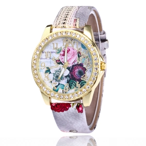 Elegant gold quartz watch for women with rhinestone bezel and floral print leather strap