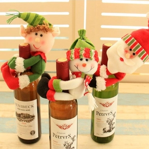 Three-piece Christmas wine bottle covers featuring Santa, Snowman and Elf plush designs