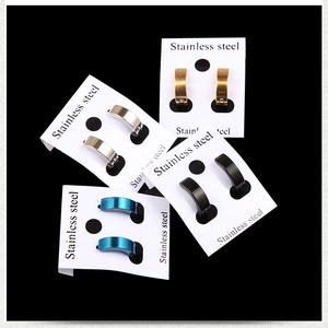 Four pairs of stainless steel hoop earrings in gold silver black and blue finishes