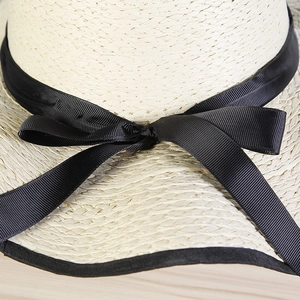 Beige wide brim straw sun hat with black ribbon bow for women summer beach travel wear