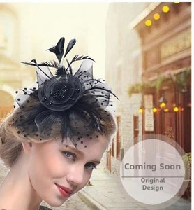 Detail of vintage black fascinator hat with feathers and polka dot mesh on a model