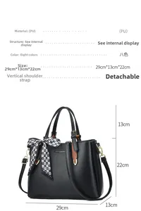 Detail view of black PU tote bag with dimensions 29x13x22cm and detachable shoulder strap