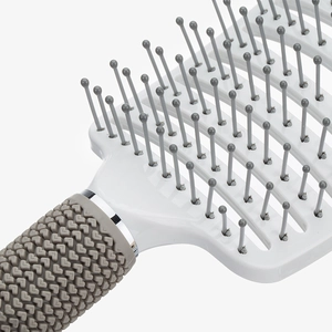 White curved hairbrush with grey bristles and vented design for scalp massage