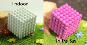 5mm magnetic buckyballs cube showing light-sensitive color change from white to pink