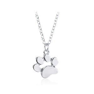 Silver chain necklace with a cute animal paw print pendant on a white reflective surface