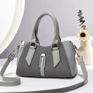 Minimalist grey patchwork crossbody phone bag with silver buckle and detachable strap