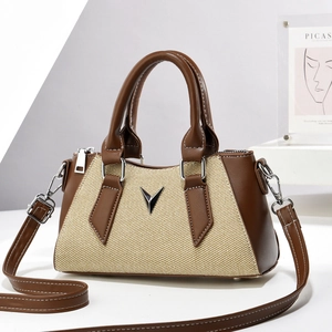 Minimalist beige woven crossbody bag with brown faux leather trim and V-shaped logo