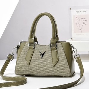 Mini minimalist crossbody bag in olive green with woven panels and silver V-shaped hardware