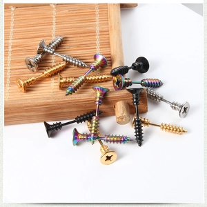 Detailed view of screw-shaped titanium steel earrings in gold, silver, black and rainbow