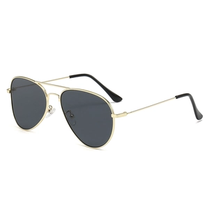 Classic aviator sunglasses with gold metal frame and dark lenses from a 45-degree angle