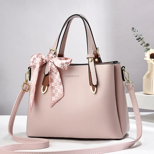 Elegant light pink crossbody handbag for women featuring a stylish heart pattern silk scarf