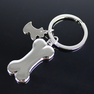 Polished silver metal keychain featuring a dog bone and Scottie dog silhouette charms