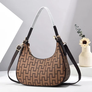 Retro monogram crescent hobo bag with adjustable brown leather strap and zip closure